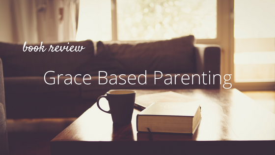 couch, coffee table, cup. text: Book Review: Grace Based Parenting