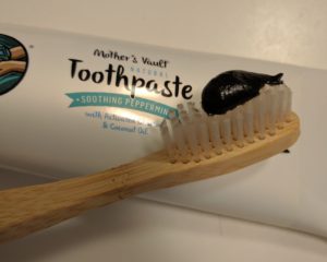 black toothpaste on brush