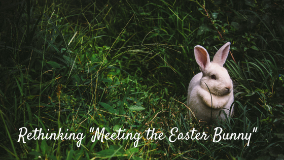 white rabbit in grass. Text: Rethinking "Meeting the Easter Bunny"
