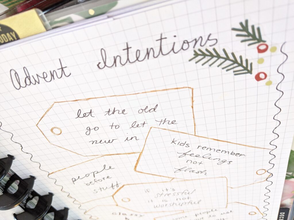 Notebook featuring Advent Intentions, illustrated with holly and gift tags
